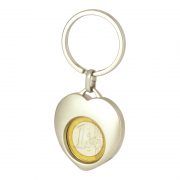 Heart shaped metal coin key holder, whose surface is shiny.