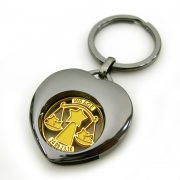 Heart Shape Metal Coin Key Holder with cute logo in its hollow.