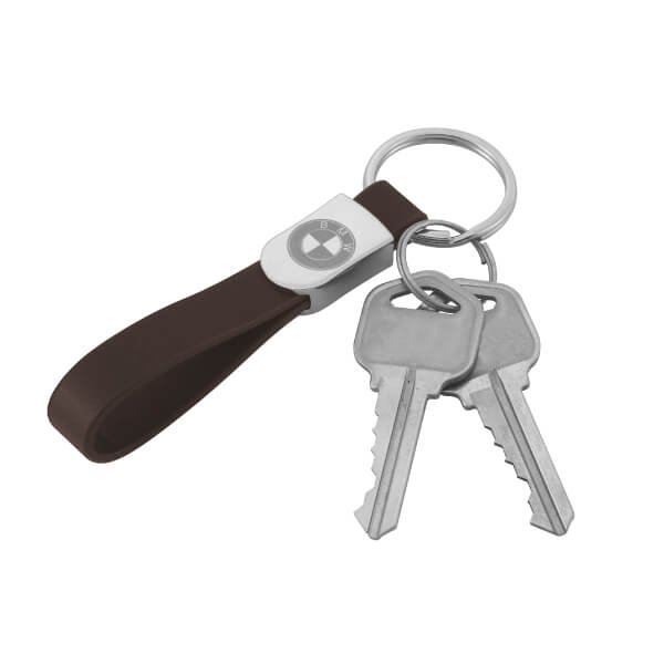 The scene is of a Customized Engraved Logo Leather Keychain with keys on it.