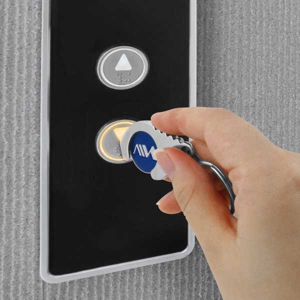 Use Antimicrobial Door Opener to push the elevator buttom