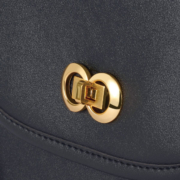 Metal Bag with Infinity Symbol Secure the bag with a buckle.